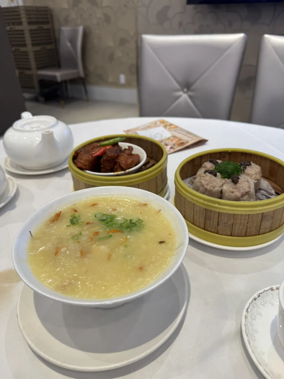 Dim sum and congee on a white tablecloth